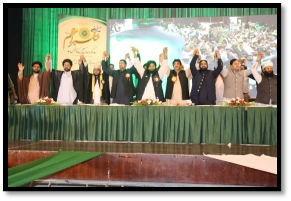 Group of men raising hands together
