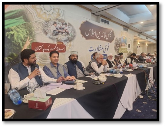 2MYC2025Jul Conference with multiple speakers at table.