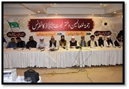 Conference with speakers at a table